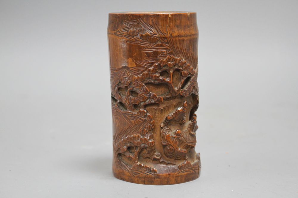 A Chinese bamboo brush pot, carved with scholars playing weiqi, late 19th/early 20th century H. 11.7cm